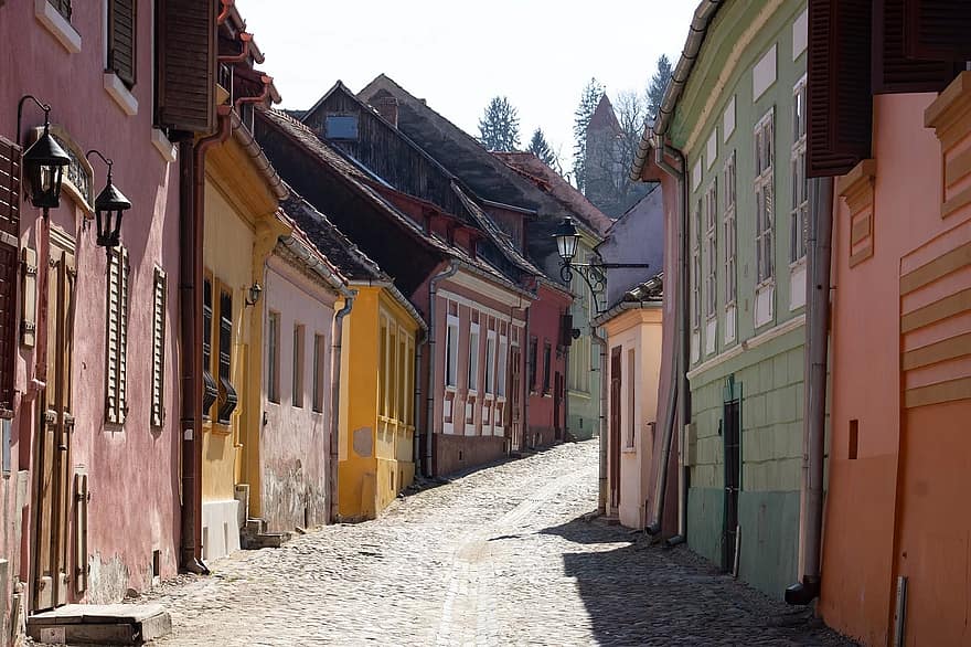 colourful houses and narrow cobblestone streets in Sighisoara, one of the best places to visit in transylvania