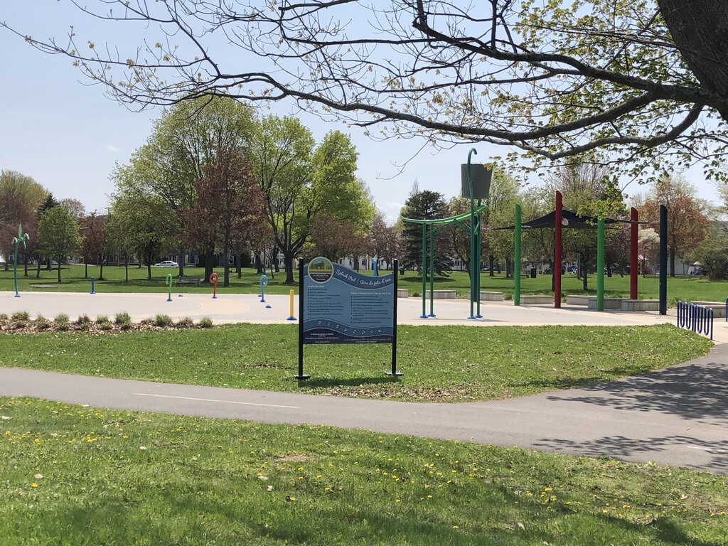 wilmot park in fredericton, green grass with a large splash pad in the centre